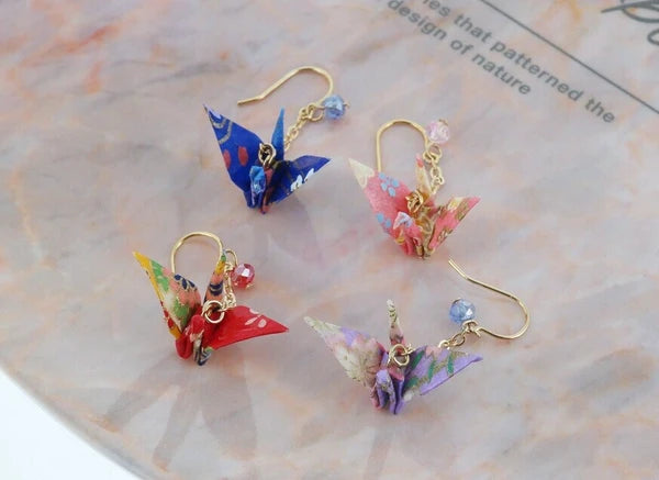 Pierced earrings with origami crane